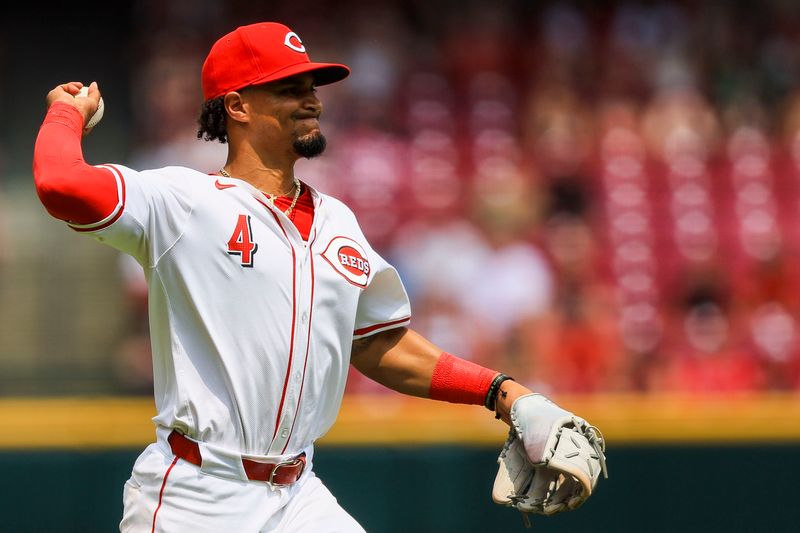 Jul 14, 2024; Cincinnati, Ohio, USA; Cincinnati Reds third baseman Santiago Espinal (4) throws to first to get Miami Marlins outfielder Vidal Brujan (not pictured) out in the seventh inning at Great American Ball Park. Mandatory Credit: Katie Stratman-USA TODAY Sports