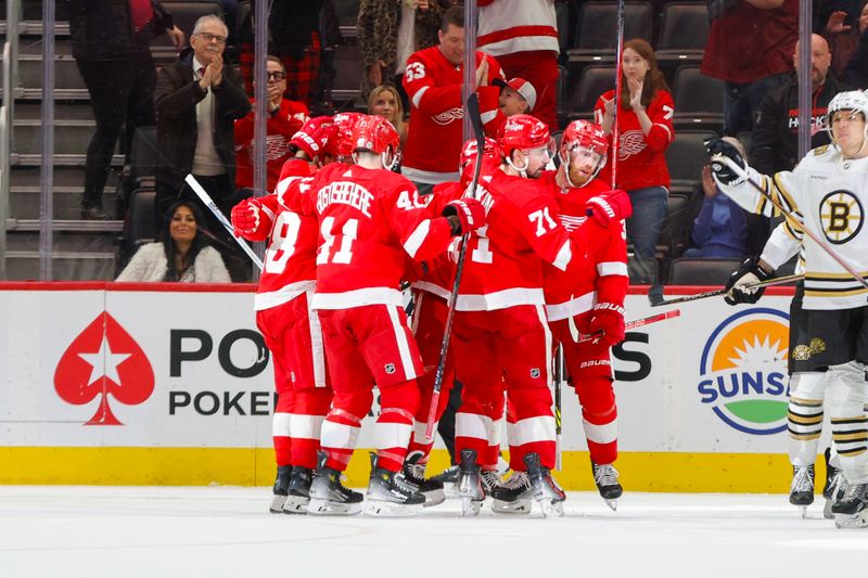 Dec 31, 2023; Detroit, Michigan, USA; The Detroit Red Wings celebrate a goal during the third period of the game between the Boston Bruins and the Detroit Red Wings at Little Caesars Arena. Mandatory Credit: Brian Bradshaw Sevald-USA TODAY Sports