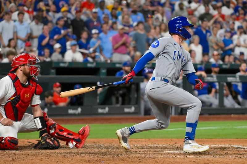 Jun 24, 2025; St. Louis, Missouri, USA;  Chicago Cubs center fielder Pete Crow-Armstrong (4) hits a single against the St. Louis Cardinals during the ninth inning at Busch Stadium. Mandatory Credit: Jeff Curry-Imagn Images