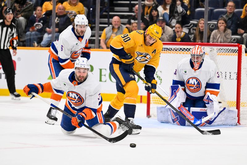 Jan 8, 2026; Nashville, Tennessee, USA; New York Islanders defenseman Adam Pelech (3) clears the puck from the New York Islanders zone during the third period at Bridgestone Arena. Mandatory Credit: Steve Roberts-Imagn Images