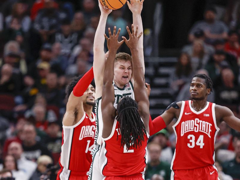 Mar 10, 2023; Chicago, IL, USA; Michigan State Spartans forward Jaxon Kohler (0) tries to pass the ball against Ohio State Buckeyes guard Bruce Thornton (2) during the first half at United Center. Mandatory Credit: Kamil Krzaczynski-USA TODAY Sports