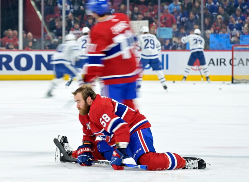 Mar 9, 2024; Montreal, Quebec, CAN; Montreal Canadiens defenseman David Savard (58) stretches during the warm up period before the game against the Toronto Maple Leafs at the Bell Centre. Mandatory Credit: Eric Bolte-USA TODAY Sports