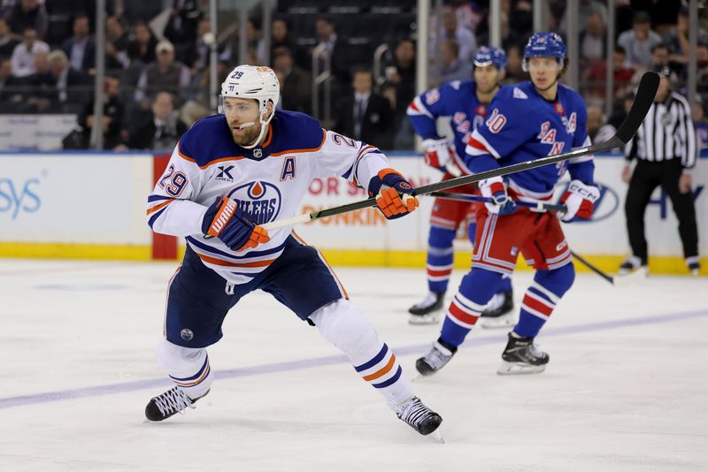 Oct 14, 2025; New York, New York, USA; Edmonton Oilers center Leon Draisaitl (29) skates against the New York Rangers during the third period at Madison Square Garden. Mandatory Credit: Brad Penner-Imagn Images
