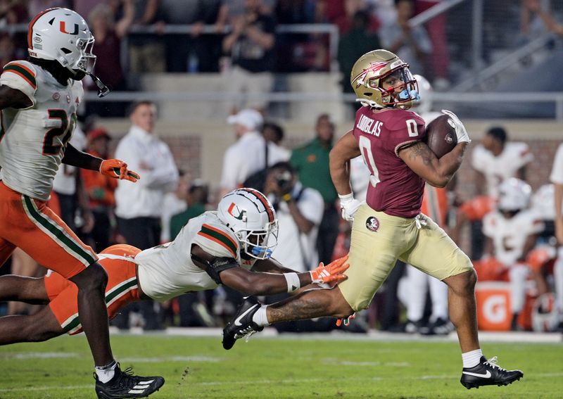 Nov 11, 2023; Tallahassee, Florida, USA; Florida State Seminoles wide receiver Ja'Khi Douglas (0) runs the ball against the Miami Hurricanes in the second half at Doak S. Campbell Stadium. Mandatory Credit: Melina Myers-USA TODAY Sports