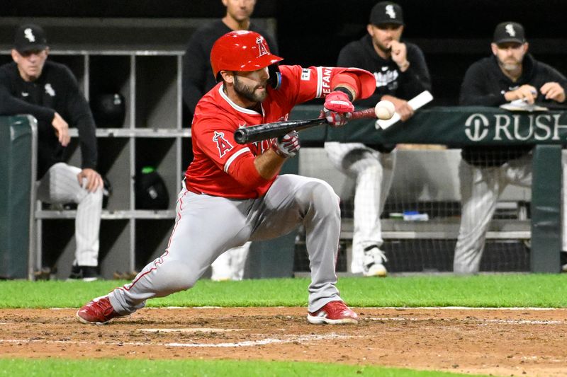 Sep 25, 2024; Chicago, Illinois, USA;  Los Angeles Angels second baseman Michael Stefanic (38) hits an RBI bunt single against the Chicago White Sox during the eighth inning at Guaranteed Rate Field. Mandatory Credit: Matt Marton-Imagn Images