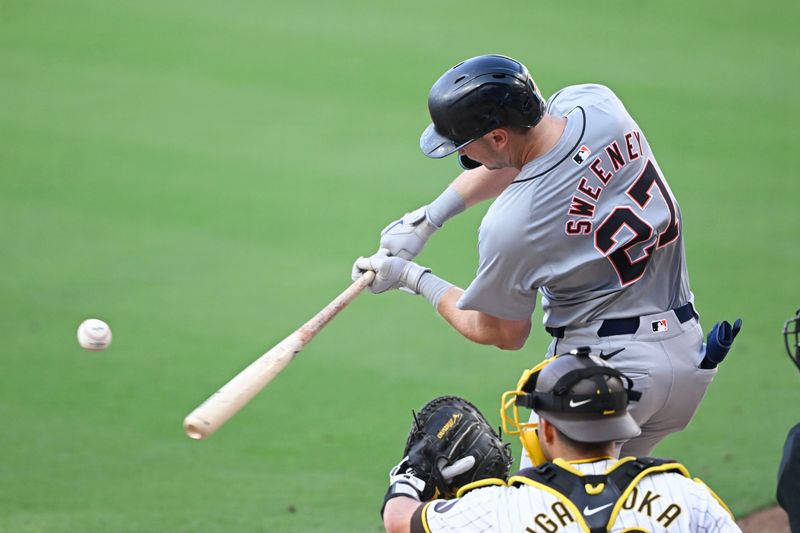 Sep 2, 2024; San Diego, California, USA; Detroit Tigers shortstop Trey Sweeney (27) hits a single during the sixth inning against the San Diego Padres at Petco Park. Mandatory Credit: Denis Poroy-USA TODAY Sports