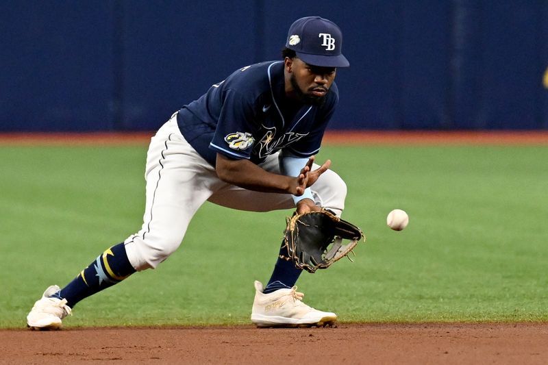 Aug 26, 2023; St. Petersburg, Florida, USA; Tampa Bay Rays shortstop Osleivis Basabe (37) fields a ground ball against the New York Yankees in the first inning at Tropicana Field. Mandatory Credit: Jonathan Dyer-USA TODAY Sports