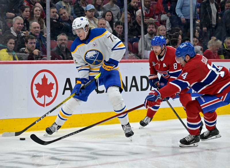 Feb 21, 2024; Montreal, Quebec, CAN; Buffalo Sabres forward Tage Thompson (72) plays the puck and Montreal Canadiens forward Nick Suzuki (14) defends during the second period at the Bell Centre. Mandatory Credit: Eric Bolte-USA TODAY Sports