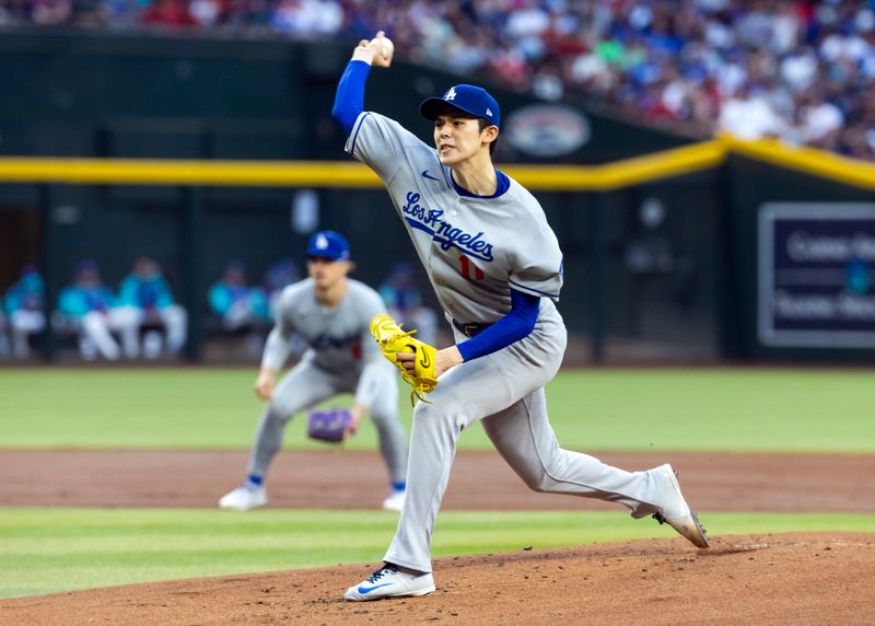 May 9, 2025; Phoenix, Arizona, USA; Los Angeles Dodgers pitcher Roki Sasaki against the Arizona Diamondbacks in the first inning at Chase Field. Mandatory Credit: Mark J. Rebilas-Imagn Images