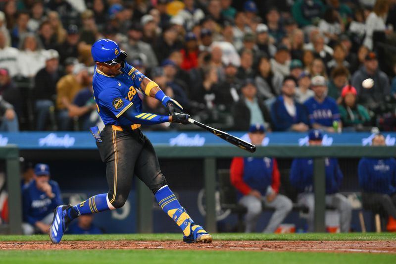 Sep 14, 2024; Seattle, Washington, USA; Seattle Mariners center fielder Julio Rodriguez (44) hits a home run against the Texas Rangers during the third inning at T-Mobile Park. Mandatory Credit: Steven Bisig-Imagn Images