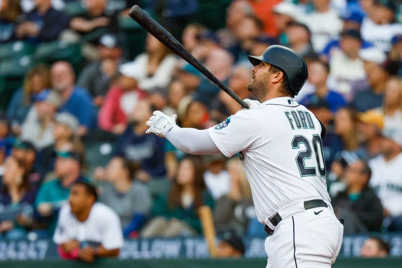 Jun 13, 2023; Seattle, Washington, USA; Seattle Mariners designated hitter Mike Ford (20) hits a two-run home run against the Miami Marlins during the fourth inning at T-Mobile Park. Mandatory Credit: Joe Nicholson-USA TODAY Sports