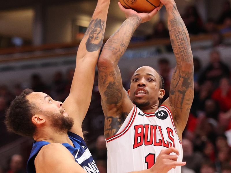 CHICAGO, ILLINOIS - FEBRUARY 06: DeMar DeRozan #11 of the Chicago Bulls shoots over Kyle Anderson #1 of the Minnesota Timberwolves during the second half at the United Center on February 06, 2024 in Chicago, Illinois. NOTE TO USER: User expressly acknowledges and agrees that, by downloading and or using this photograph, User is consenting to the terms and conditions of the Getty Images License Agreement.  (Photo by Michael Reaves/Getty Images)