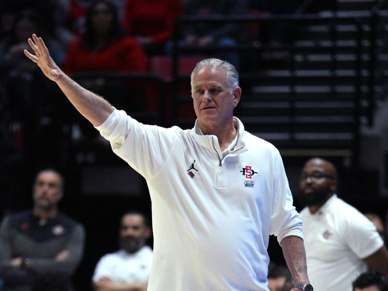 Jan 25, 2023; San Diego, California, USA; San Diego State Aztecs head coach Brian Dutcher gestures during the first half against the Utah State Aggies at Viejas Arena. Mandatory Credit: Orlando Ramirez-USA TODAY Sports