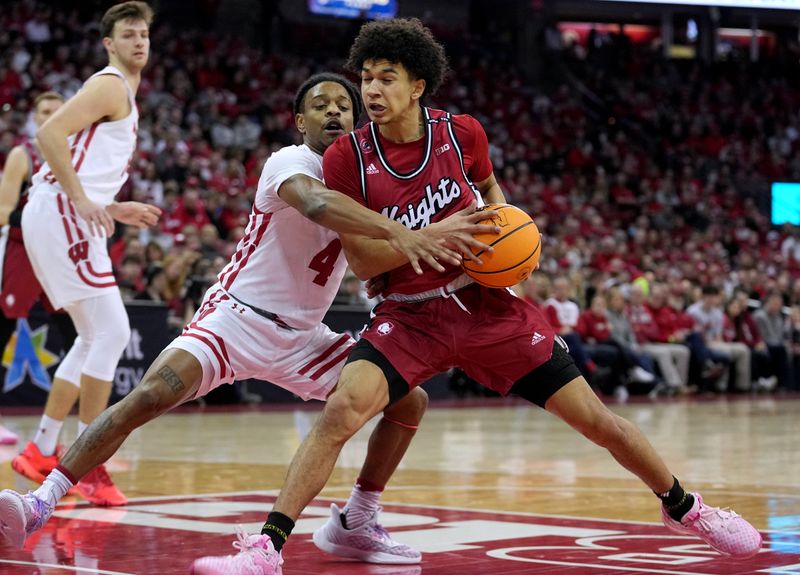 Feb. 18, 2023; Madison, WI, USA; Wisconsin Badgers guard Kamari McGee (4) plays defense on Rutgers Scarlet Knights guard Derek Simpson (0) during the first half at the Kohl Center. Mandatory Credit: Mark Hoffman-USA TODAY Sports