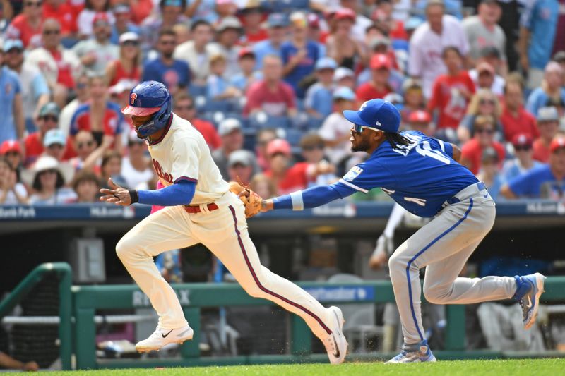 Aug 6, 2023; Philadelphia, Pennsylvania, USA; Philadelphia Phillies center fielder Johan Rojas (18) is tagged out during a rundown by Kansas City Royals third baseman Maikel Garcia (11) during the seventh inning at Citizens Bank Park. Mandatory Credit: Eric Hartline-USA TODAY Sports