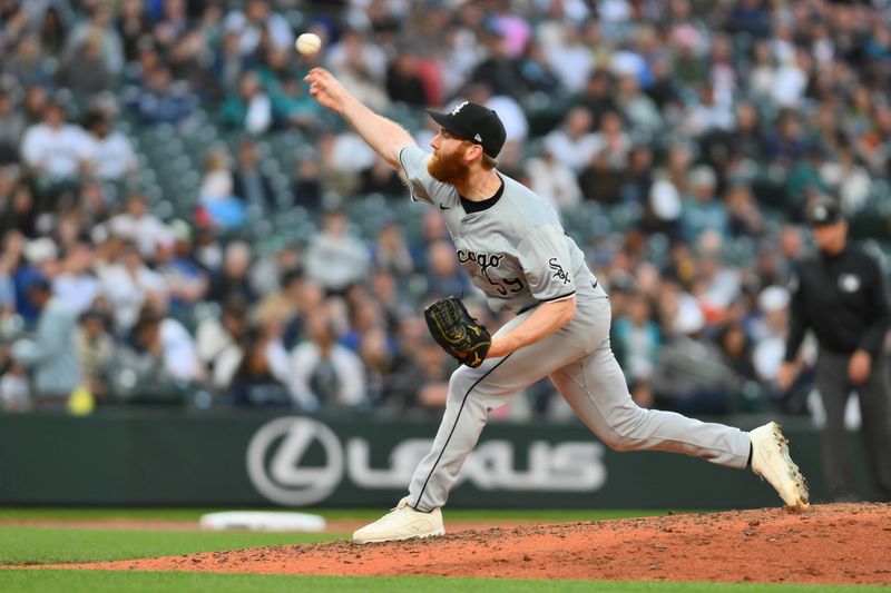 Jun 13, 2024; Seattle, Washington, USA; Chicago White Sox relief pitcher John Brebbia (59) pitches to the Seattle Mariners during the eighth inning at T-Mobile Park. Mandatory Credit: Steven Bisig-USA TODAY Sports