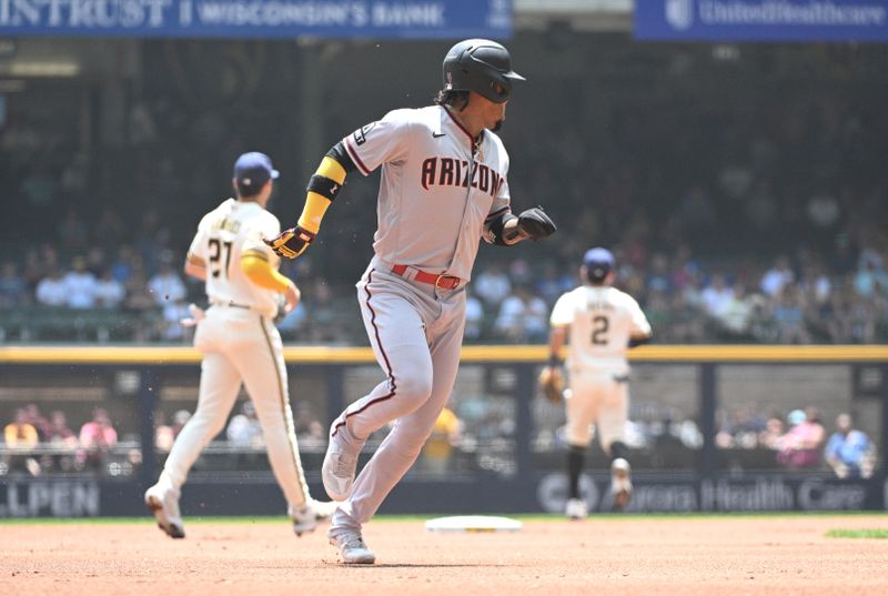 Jun 21, 2023; Milwaukee, Wisconsin, USA; Arizona Diamondbacks second baseman Ketel Marte (4) runs to third base against the Milwaukee Brewers in the first inning at American Family Field. Mandatory Credit: Michael McLoone-USA TODAY Sports