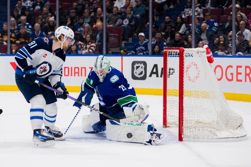 Mar 9, 2024; Vancouver, British Columbia, CAN; Vancouver Canucks goalie Casey DeSmith (29) makes a save on Winnipeg Jets forward Kyle Connor (81) in the third period at Rogers Arena. Canucks won 5-0. Mandatory Credit: Bob Frid-USA TODAY Sports