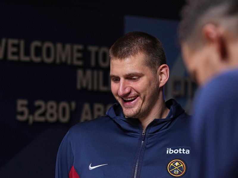 DENVER, CO - MARCH 31: Nikola Jokic #15 of the Denver Nuggets smiles before the game against the Cleveland Cavaliers on March 31, 2024 at the Ball Arena in Denver, Colorado. NOTE TO USER: User expressly acknowledges and agrees that, by downloading and/or using this Photograph, user is consenting to the terms and conditions of the Getty Images License Agreement. Mandatory Copyright Notice: Copyright 2024 NBAE (Photo by Garrett Ellwood/NBAE via Getty Images)