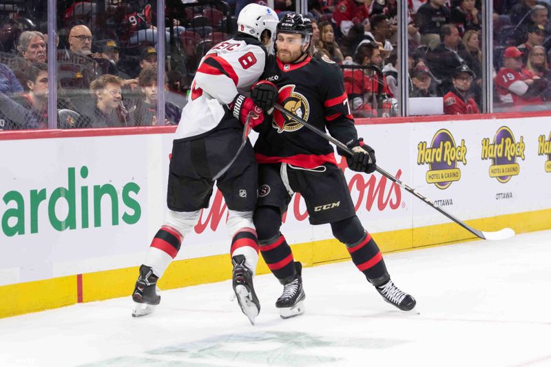 Oct 17, 2024; Ottawa, Ontario, CAN; New Jersey Devils defensdeman Joohnathan Kovacevic (8) is checked by Ottawa Senators left wing Noah Gregor (73) in the first period at the Canadian Tire Centre. Mandatory Credit: Marc DesRosiers-Imagn Images