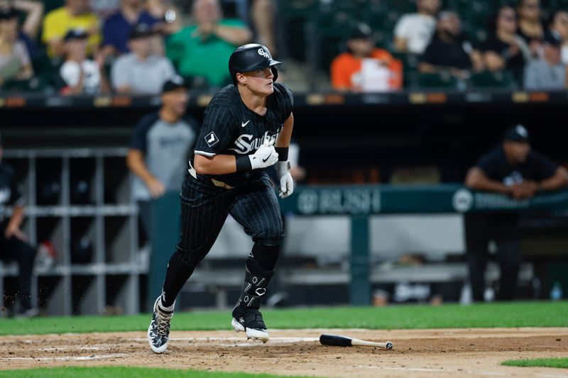 Aug 26, 2024; Chicago, Illinois, USA; Chicago White Sox first baseman Andrew Vaughn (25) hits an RBI-single against the Detroit Tigers during the third inning at Guaranteed Rate Field. Mandatory Credit: Kamil Krzaczynski-USA TODAY Sports