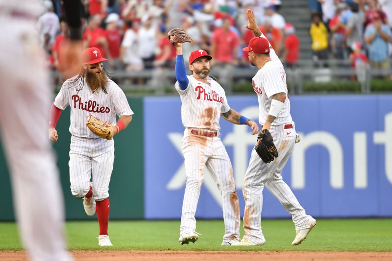 Jul 26, 2023; Philadelphia, Pennsylvania, USA;  Philadelphia Phillies left fielder Jake Cave (44) gets a high five from right fielder Nick Castellanos (8) after making a catch against the wall during the sixth inning against the Baltimore Orioles at Citizens Bank Park. Mandatory Credit: Eric Hartline-USA TODAY Sports