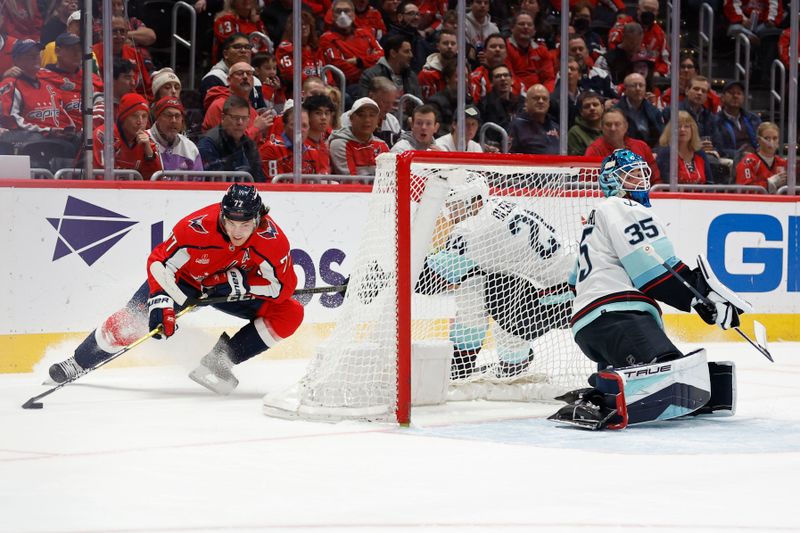 Jan 11, 2024; Washington, District of Columbia, USA; Washington Capitals right wing T.J. Oshie (77) skates in on Seattle Kraken goaltender Joey Daccord (35) in the first period at Capital One Arena. Mandatory Credit: Geoff Burke-USA TODAY Sports