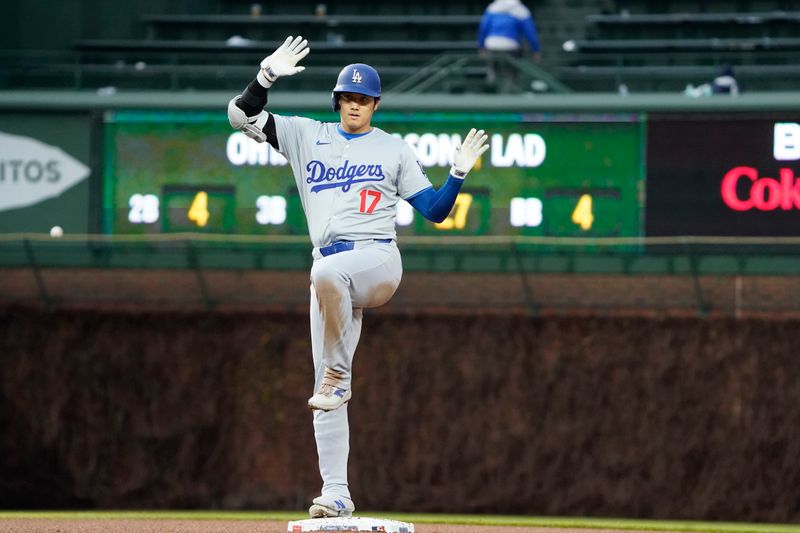 Apr 7, 2024; Chicago, Illinois, USA; Los Angeles Dodgers designated hitter Shohei Ohtani (17) gestures after hitting a one run double against the Chicago Cubs during the eighth inning at Wrigley Field. Mandatory Credit: David Banks-USA TODAY Sports