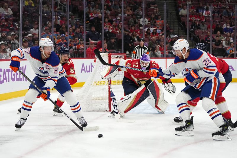 Nov 20, 2023; Sunrise, Florida, USA; Edmonton Oilers center Connor McDavid (97) passes the puck in front of Florida Panthers left wing Ryan Lomberg (94) during the first period at Amerant Bank Arena. Mandatory Credit: Jasen Vinlove-USA TODAY Sports