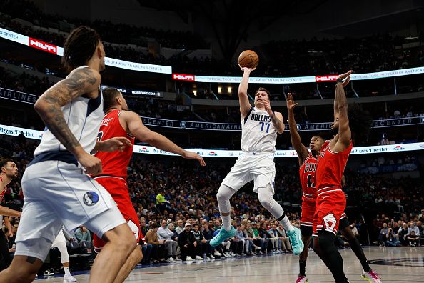 DALLAS, TEXAS - NOVEMBER 01: Luka Doncic #77 of the Dallas Mavericks shoots the ball against Ayo Dosunmu #12 of the Chicago Bulls in the first half at American Airlines Center on November 01, 2023 in Dallas, Texas. NOTE TO USER: User expressly acknowledges and agrees that, by downloading and or using this photograph, User is consenting to the terms and conditions of the Getty Images License Agreement. (Photo by Tim Heitman/Getty Images)