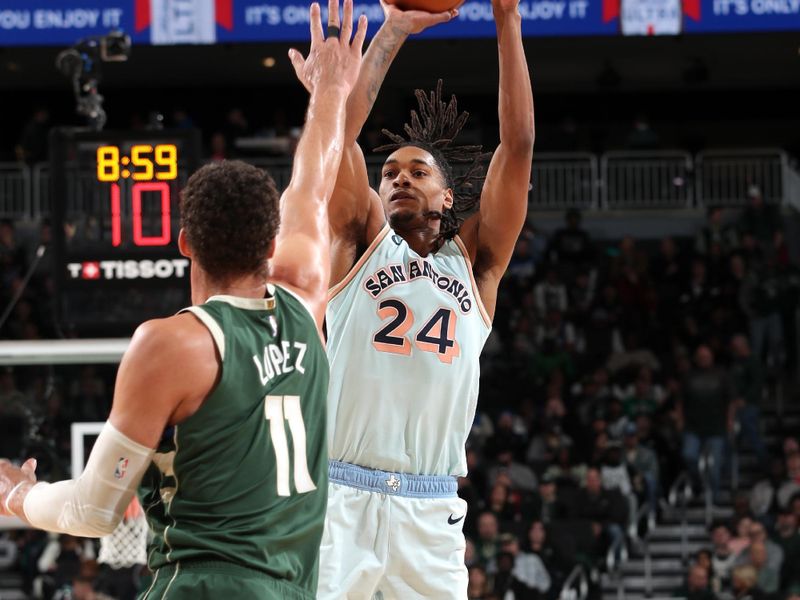 MILWAUKEE, WI - JANUARY 8: Devin Vassell #24 of the San Antonio Spurs shoots the ball during the game against the Milwaukee Bucks on January 8, 2025 at the Fiserv Forum Center in Milwaukee, Wisconsin. NOTE TO USER: User expressly acknowledges and agrees that, by downloading and or using this Photograph, user is consenting to the terms and conditions of the Getty Images License Agreement. Mandatory Copyright Notice: Copyright 2025 NBAE (Photo by Gary Dineen/NBAE via Getty Images).