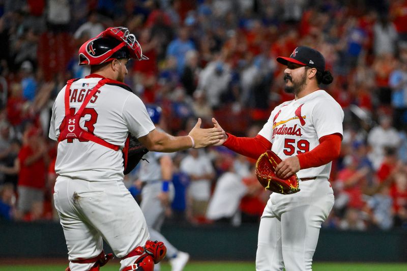 Aug 10, 2025; St. Louis, Missouri, USA;  St. Louis Cardinals relief pitcher JoJo Romero (59) celebrates with catcher Pedro Pages (43) after the Cardinals defeated the Chicago Cubs at Busch Stadium. Mandatory Credit: Jeff Curry-Imagn Images