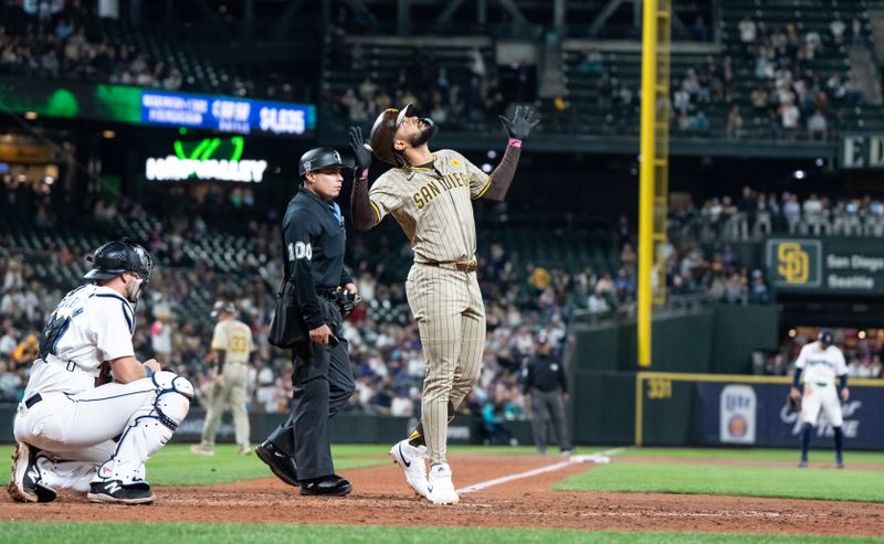 Sep 11, 2024; Seattle, Washington, USA;  San Diego Padres right fielder Fernando Tatis Jr. (23) celebrates after hitting a solo home run during the seventh inning against the Seattle Mariners at T-Mobile Park. Mandatory Credit: Stephen Brashear-Imagn Images