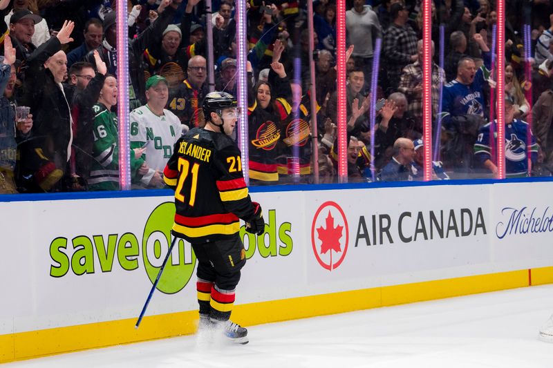 Jan 20, 2024; Vancouver, British Columbia, CAN; Vancouver Canucks forward Nils Hoglander (21) celebrates his second goal of the game against the Toronto Maple Leafs in the first period at Rogers Arena. Mandatory Credit: Bob Frid-USA TODAY Sports