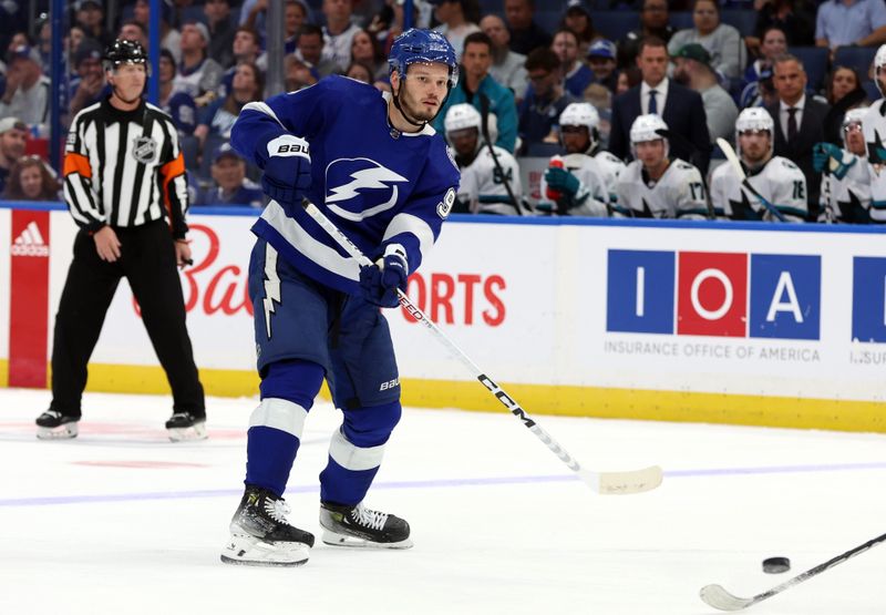 Oct 26, 2023; Tampa, Florida, USA; Tampa Bay Lightning defenseman Mikhail Sergachev (98) passes the puck against the San Jose Sharks during the third period at Amalie Arena. Mandatory Credit: Kim Klement Neitzel-USA TODAY Sports