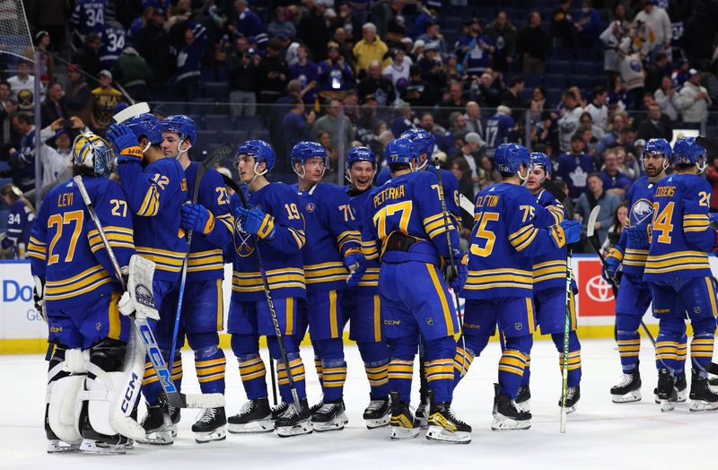 Dec 21, 2023; Buffalo, New York, USA;  The Buffalo Sabres celebrate a win over the Toronto Maple Leafs at KeyBank Center. Mandatory Credit: Timothy T. Ludwig-USA TODAY Sports