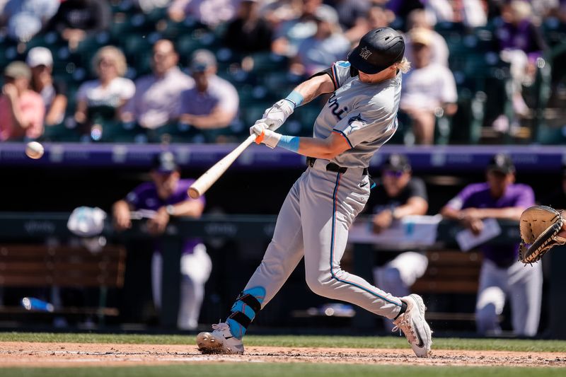 Aug 29, 2024; Denver, Colorado, USA; Miami Marlins left fielder Kyle Stowers (28) hits an RBI single in the third inning against the Colorado Rockies at Coors Field. Mandatory Credit: Isaiah J. Downing-USA TODAY Sports