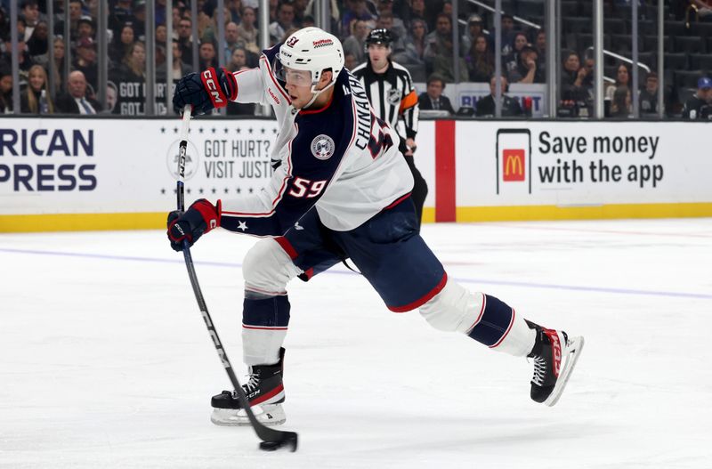 Nov 9, 2024; Los Angeles, California, USA; Columbus Blue Jackets right wing Yegor Chinakhov (59) shoots during the third period against the Los Angeles Kings at Crypto.com Arena. Mandatory Credit: Jason Parkhurst-Imagn Images