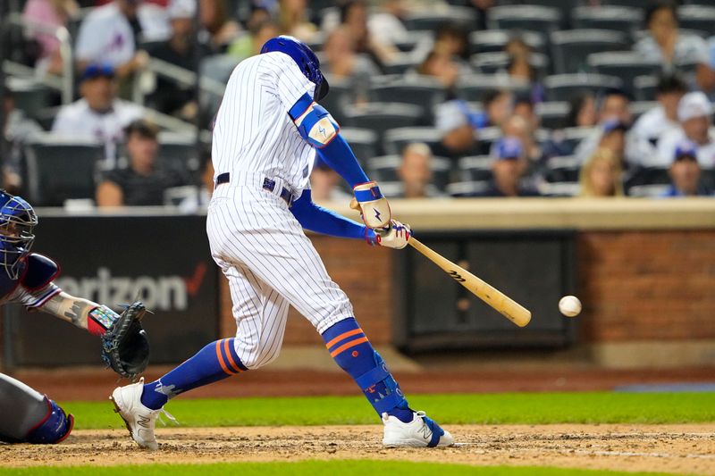 Aug 30, 2023; New York City, New York, USA; New York Mets center fielder Brandon Nimmo (9) hits a single against the Texas Rangers during the seventh inning at Citi Field. Mandatory Credit: Gregory Fisher-USA TODAY Sports