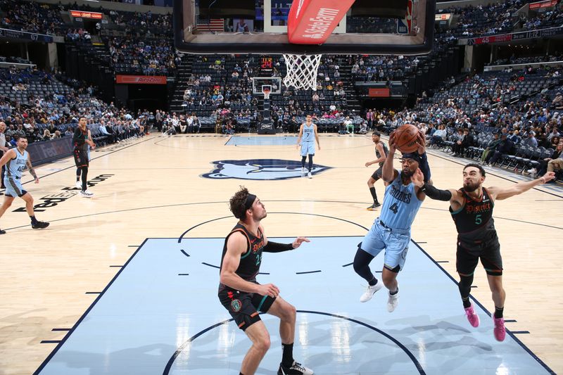 MEMPHIS, TN - MARCH 12: Jordan Goodwin #4 of the Memphis Grizzlies grabs a rebound during the game against the Washington Wizards  on March 12, 2024 at FedExForum in Memphis, Tennessee. NOTE TO USER: User expressly acknowledges and agrees that, by downloading and or using this photograph, User is consenting to the terms and conditions of the Getty Images License Agreement. Mandatory Copyright Notice: Copyright 2024 NBAE (Photo by Joe Murphy/NBAE via Getty Images)