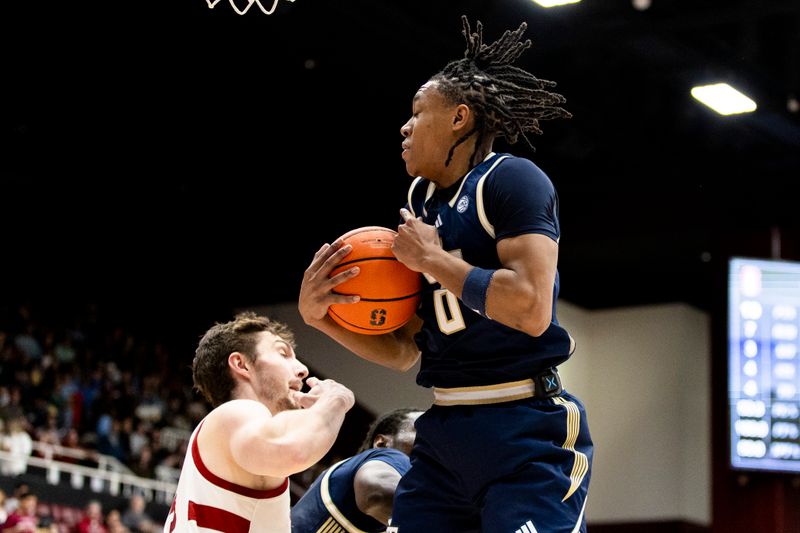 Feb 7, 2026; Stanford, California, USA;  Georgia Tech Yellow Jackets guard Akai Fleming (0) gets the rebound against the Stanford Cardinal during the first half at Maples Pavilion. Mandatory Credit: John Hefti-Imagn Images