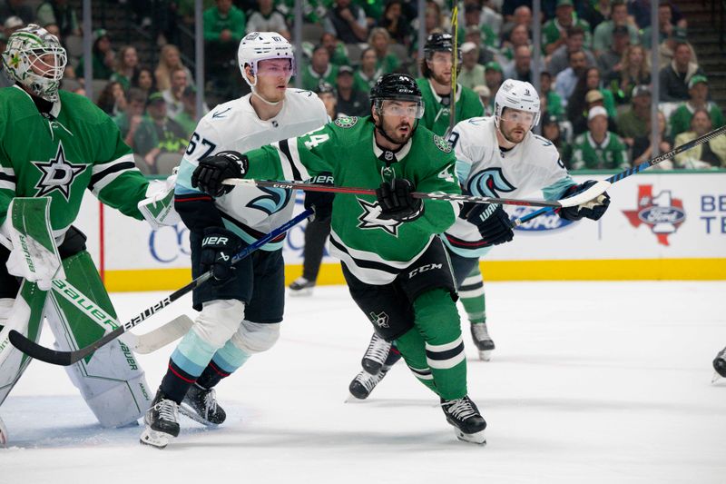 May 15, 2023; Dallas, Texas, USA; Dallas Stars goaltender Jake Oettinger (29) and defenseman Joel Hanley (44) and Seattle Kraken center Morgan Geekie (67) look for the puck in the Seattle zone during the first period in game seven of the second round of the 2023 Stanley Cup Playoffs at the American Airlines Center. Mandatory Credit: Jerome Miron-USA TODAY Sports