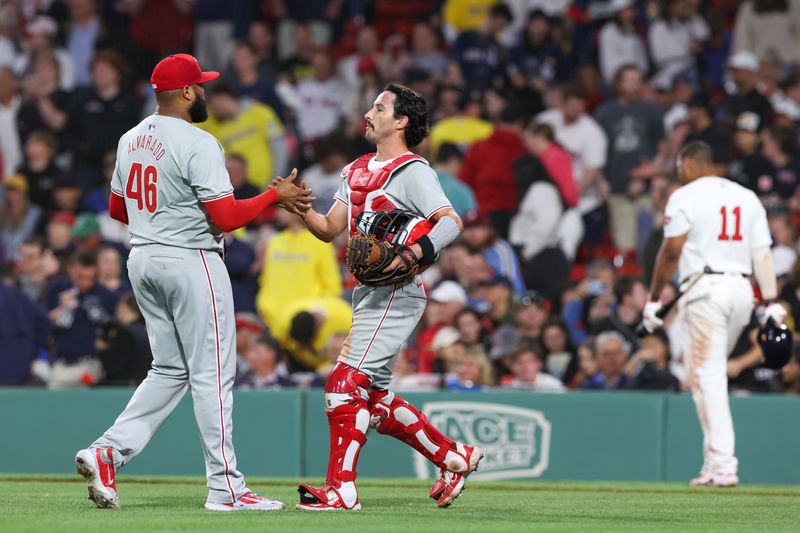 Jun 11, 2024; Boston, Massachusetts, USA; Philadelphia Phillies relief pitcher Jose Alvarado (46) and Philadelphia Phillies catcher Garrett Stubbs (21) celebrate after defeating the Boston Red Sox at Fenway Park. Mandatory Credit: Paul Rutherford-USA TODAY Sports