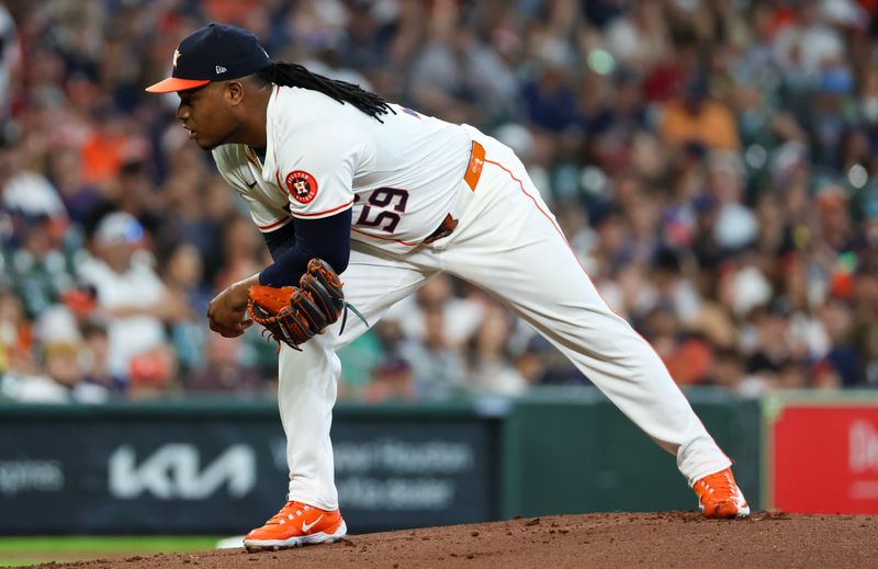 Jun 23, 2024; Houston, Texas, USA;  Houston Astros starting pitcher Framber Valdez (59) looks before pitches against the Baltimore Orioles in the first inning at Minute Maid Park. Mandatory Credit: Thomas Shea-USA TODAY Sports