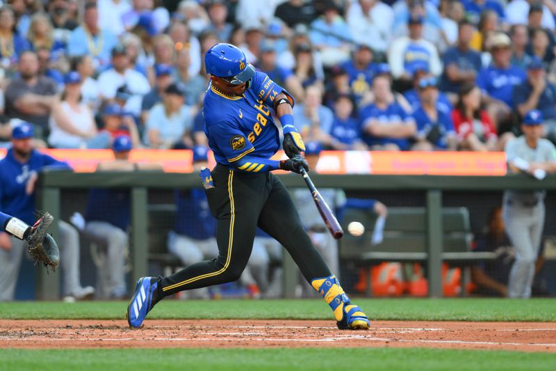 Jul 5, 2024; Seattle, Washington, USA; Seattle Mariners center fielder Julio Rodriguez (44) hits a single against the Toronto Blue Jays during the third inning at T-Mobile Park. Mandatory Credit: Steven Bisig-USA TODAY Sports