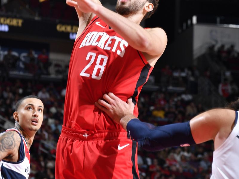 HOUSTON, TX - NOVEMBER 11: Alperen Sengun #28 of the Houston Rockets shoots the ball during the game against the Washington Wizards on November 11, 2024 at the Toyota Center in Houston, Texas. NOTE TO USER: User expressly acknowledges and agrees that, by downloading and or using this photograph, User is consenting to the terms and conditions of the Getty Images License Agreement. Mandatory Copyright Notice: Copyright 2024 NBAE (Photo by Logan Riely/NBAE via Getty Images)