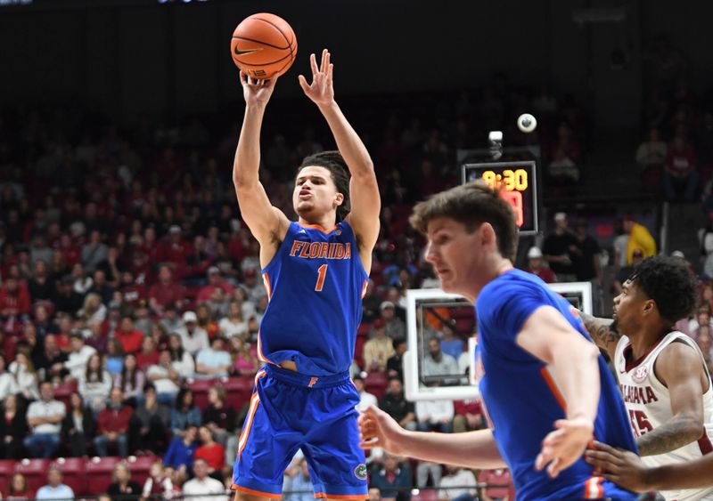 Feb 21, 2024; Tuscaloosa, Alabama, USA;  Florida Gators guard Walter Clayton Jr. (1) takes a three point shot against the Alabama Crimson Tide during the first half at Coleman Coliseum. Mandatory Credit: Gary Cosby Jr.-USA TODAY Sports