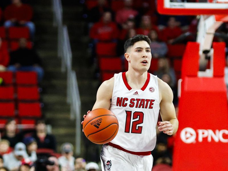 Dec 20, 2023; Raleigh, North Carolina, USA; North Carolina State Wolfpack guard Michael O'Connell (12) dribbles with the ball during the first half against Saint Louis at PNC Arena. Mandatory Credit: Jaylynn Nash-USA TODAY Sports