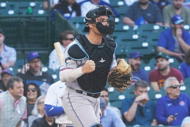 May 7, 2023; Chicago, Illinois, USA; Miami Marlins catcher Nick Fortes (4) celebrates the win against the Chicago Cubs at Wrigley Field. Mandatory Credit: David Banks-USA TODAY Sports