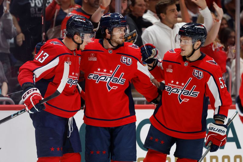 Sep 27, 2024; Washington, District of Columbia, USA; Washington Capitals forward Jakob Vrana (13) celebrates with teammates after scoring a goal against the Columbus Blue Jackets in the first period at Capital One Arena. Mandatory Credit: Geoff Burke-Imagn Images